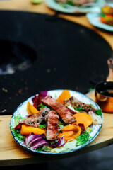 Tuna steak with pear salsa .