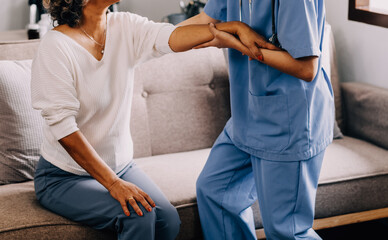 Happy young female nurse provide care medical service help support smiling old grandma at homecare...