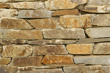 Texture of an old stone wall made of stone.