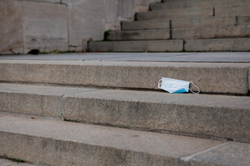 a medical mask, a mask left on the steps outside. The end of the epidemic.