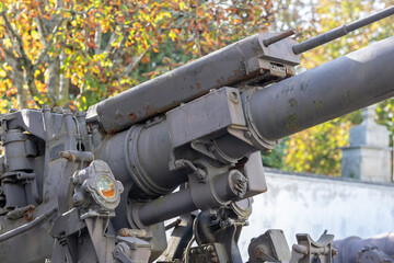 Fototapeta na wymiar A rustic metallic cannon-like object.
