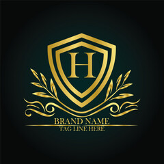 H luxury letter logo template in gold color. Elegant gold shield icon. Premium brand identity emblem. Royal coat of arms company label symbol. Modern vector Royal premium logo template vector