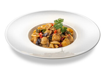 Orecchiette pasta cooked topped with eggplant and zucchini and tomato sauce and with parsley leaves in white plate isolated