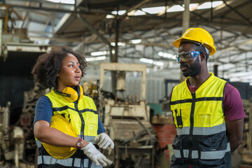 Young man and Young woman are working in industrial plants. Worker displaying his workplace and tools at workshop