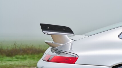 Rear spoiler on a silver car