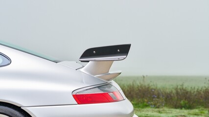 Rear spoiler on a silver car