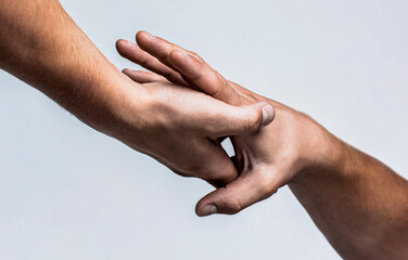 Two hands, helping arm of a friend, teamwork. Rescue, helping gesture or hands. Close up help hand....