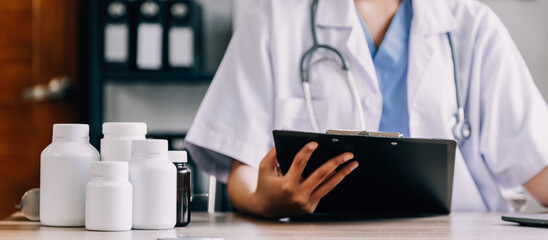 Medical technology concept. Doctor working with mobile phone and stethoscope in modern office