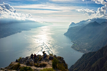 walk in the mountains with a view of Lake Garda - 670673534
