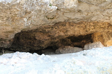 A cave with a large rock
