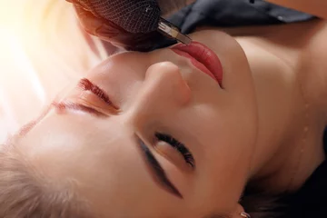 Fotobehang Process permanent tattoo red pigment makeup for lip of woman © Parilov