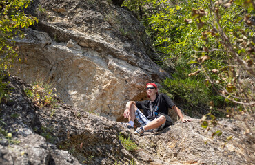 teenage boy walking  in the city in summer