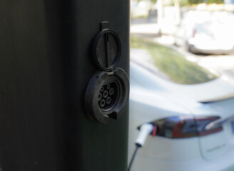 EV charging station for electric cars with green and eco-energy and sustainable energy. Alternative transportation
