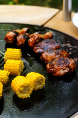 Chicken legs with grilled corn.style rustic