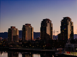 Fototapeta premium shining apartment building at twilight sunrise with beautiful light 