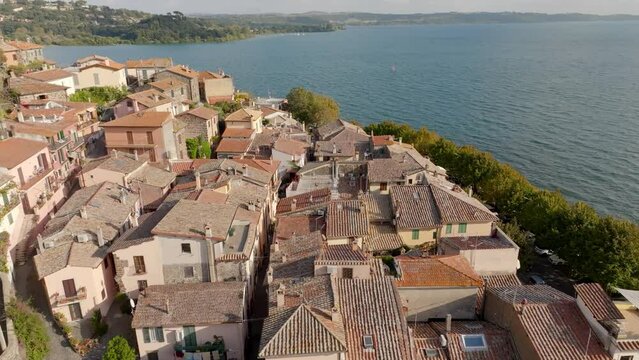 Aerial view of the sloping roofs of the houses in the historic center of Trevignano Romano, in the metropolitan city of Rome, Italy. The town is located on the volcanic Lake Bracciano.