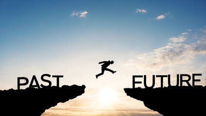 Conceptual business man jumping over gap between past to future - obrazy, fototapety, plakaty