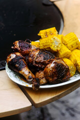 Chicken legs with grilled corn.style rustic