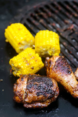 Chicken legs with grilled corn.style rustic