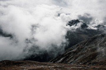 Nestled serenely amidst the rugged peaks of the majestic mountains, this pristine alpine lake captivates with its breathtaking beauty.
