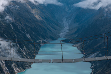 Nestled serenely amidst the rugged peaks of the majestic mountains, this pristine alpine lake...