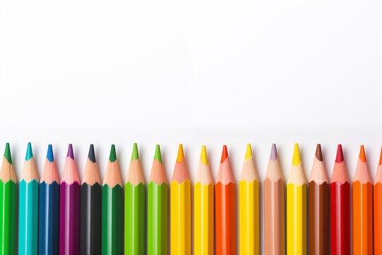 A row of colored pencils on a white background.
