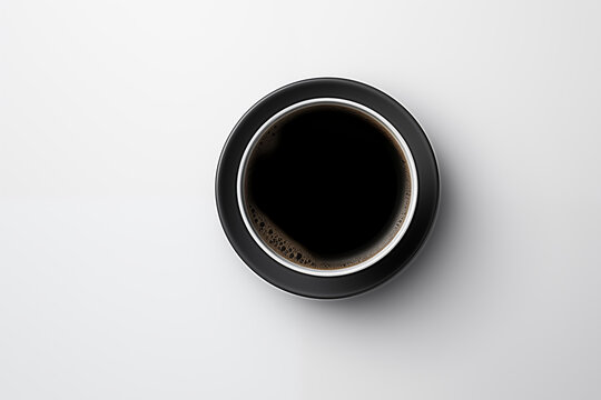 A cup of black coffee on a white isolate background ,at the right hand of photo