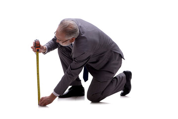 Old businessman holding tape measure isolated on white