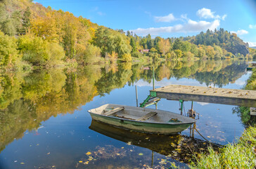 Fototapeta na wymiar Beautiful views of the river Berounka a Wooden boats in the autumn season