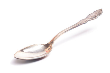 Old silver teaspoon with handle pattern isolated on white background