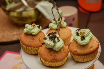 Halloween muffins with green cream. Cupcakes.