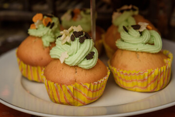 Halloween muffins with green cream. Cupcakes.