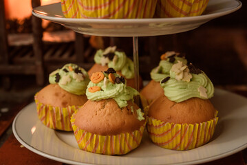 Halloween muffins with green cream. Cupcakes.