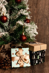 Fototapeta na wymiar Christmas tree with gifts. Christmas decor. Gifts are under the Christmas tree