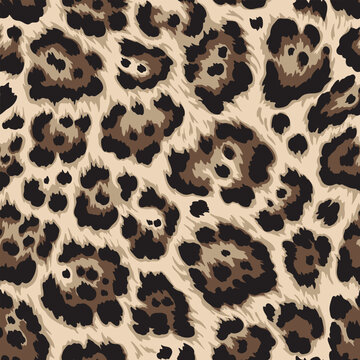 Seamless repeating vector pattern of trendy leopard print in shades of brown and cream and black perfect for fashion applications. 