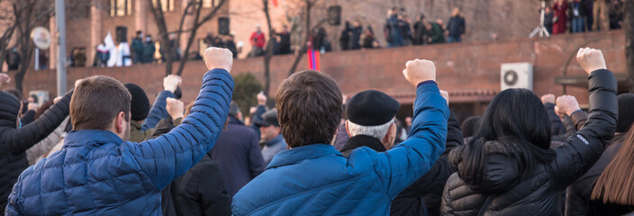 People raised hands during the demonstration - obrazy, fototapety, plakaty