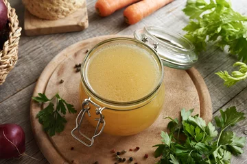 Foto op Plexiglas Chicken bone broth in a glass jar © Madeleine Steinbach