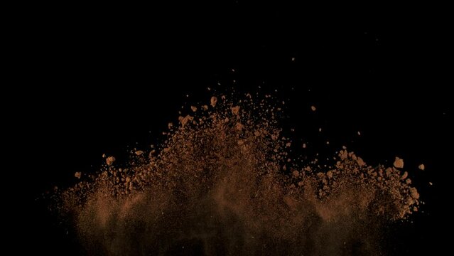 Super Slow Motion Shot of Soil Explosion Isolated on Black Background at 1000fps.