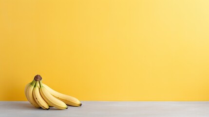  a bunch of bananas sitting on a table in front of a bright yellow wall with a brown spot on the top of the banana.  generative ai