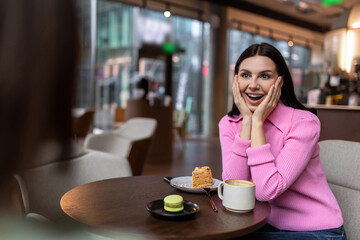 Cute smiling girl in a pink shirt looking happy