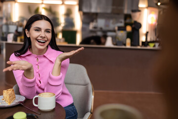 Cute smiling girl in a pink shirt looking happy