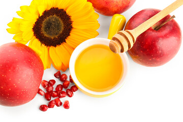 Bowl of honey with apples and sunflower for Rosh Hashanah celebration (Jewish New Year) on white background
