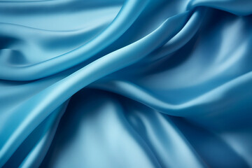 Blue silk fabric texture background. Beautiful blue satin textile texture with folds. Smooth elegant cloth abstract background. Luxurious fashion delicate blue canvas wallpaper.