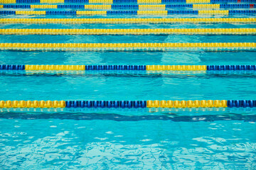 Turquoise swimming pool lanes, a symbol of sport and the Olympics.