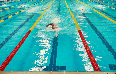 Turquoise swimming pool lanes, a symbol of sport and the Olympics.