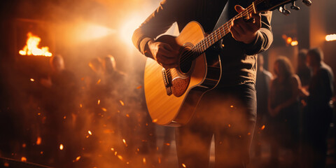 Close-up of acoustic guitar being played in concert setting - obrazy, fototapety, plakaty