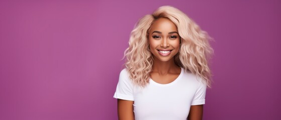 Smiling black young woman with dyed blonde hair looking at the camera on a magenta background - obrazy, fototapety, plakaty