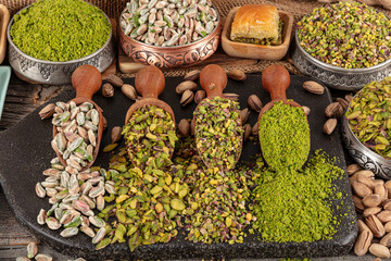 Variations of pistachios used in making pistachio baklava. Top View of Four Different Forms of...