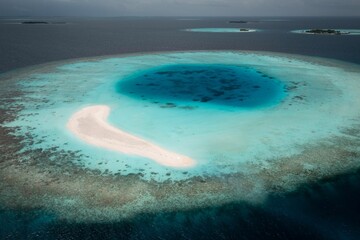 the white sand and blue water is surrounded by a island