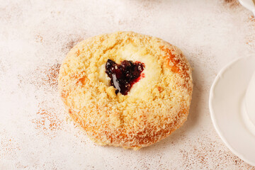 Homemade vatrushki, Russian round pastry with cottage cheese and sour cherry jam.